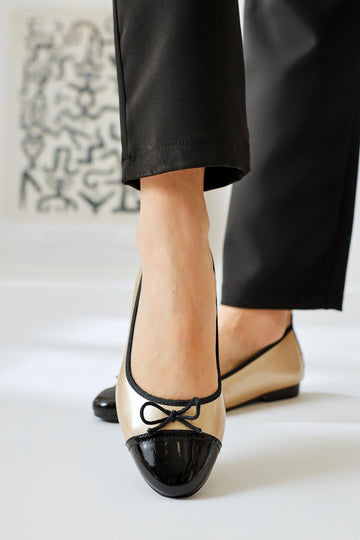 Sobhie Gold Patent Leather Black Toe Bow Detailed Ballerinas