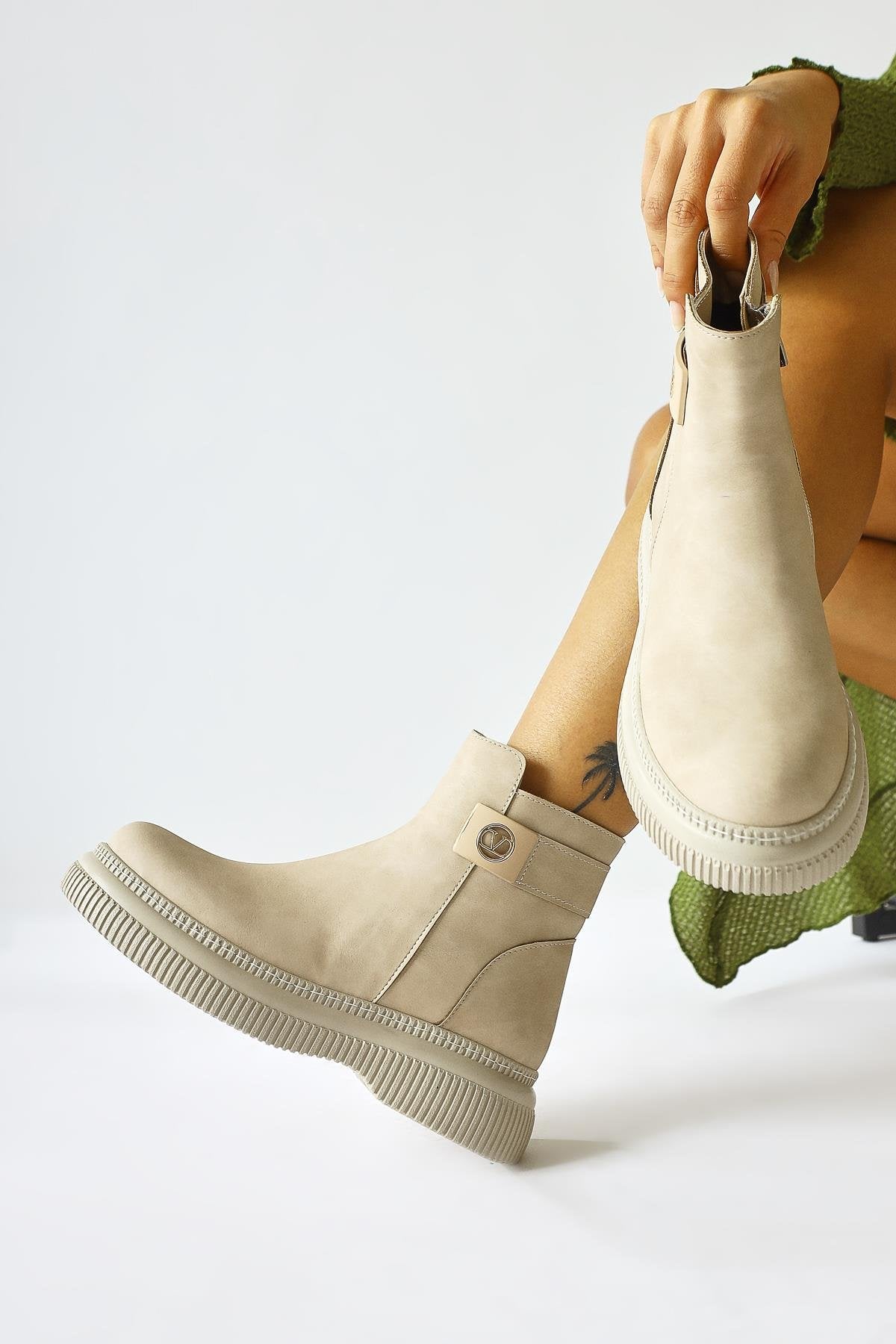Caiza – Cream Buckle-Detail Round-Toe Ankle Boot (Women)