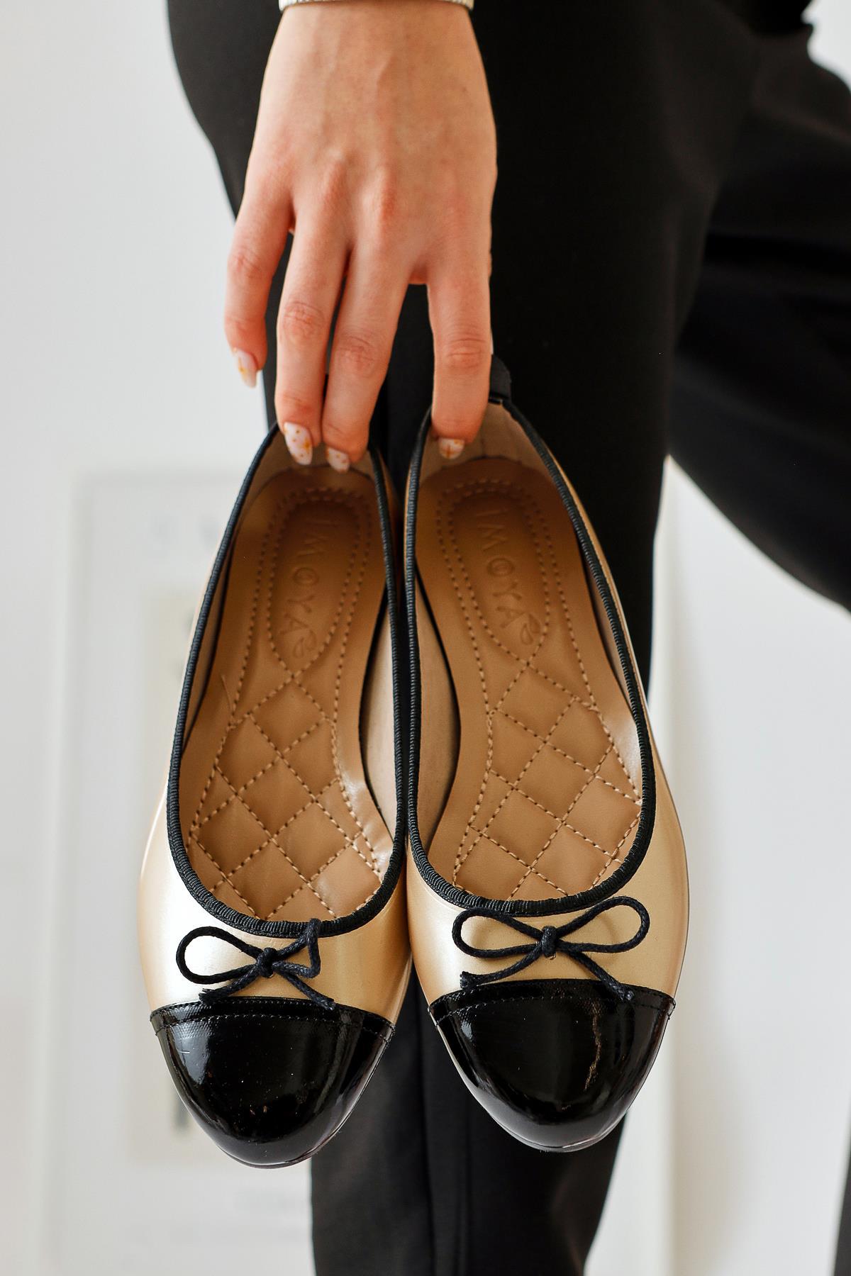 Sobhie Gold Patent Leather Black Toe Bow Detailed Ballerinas