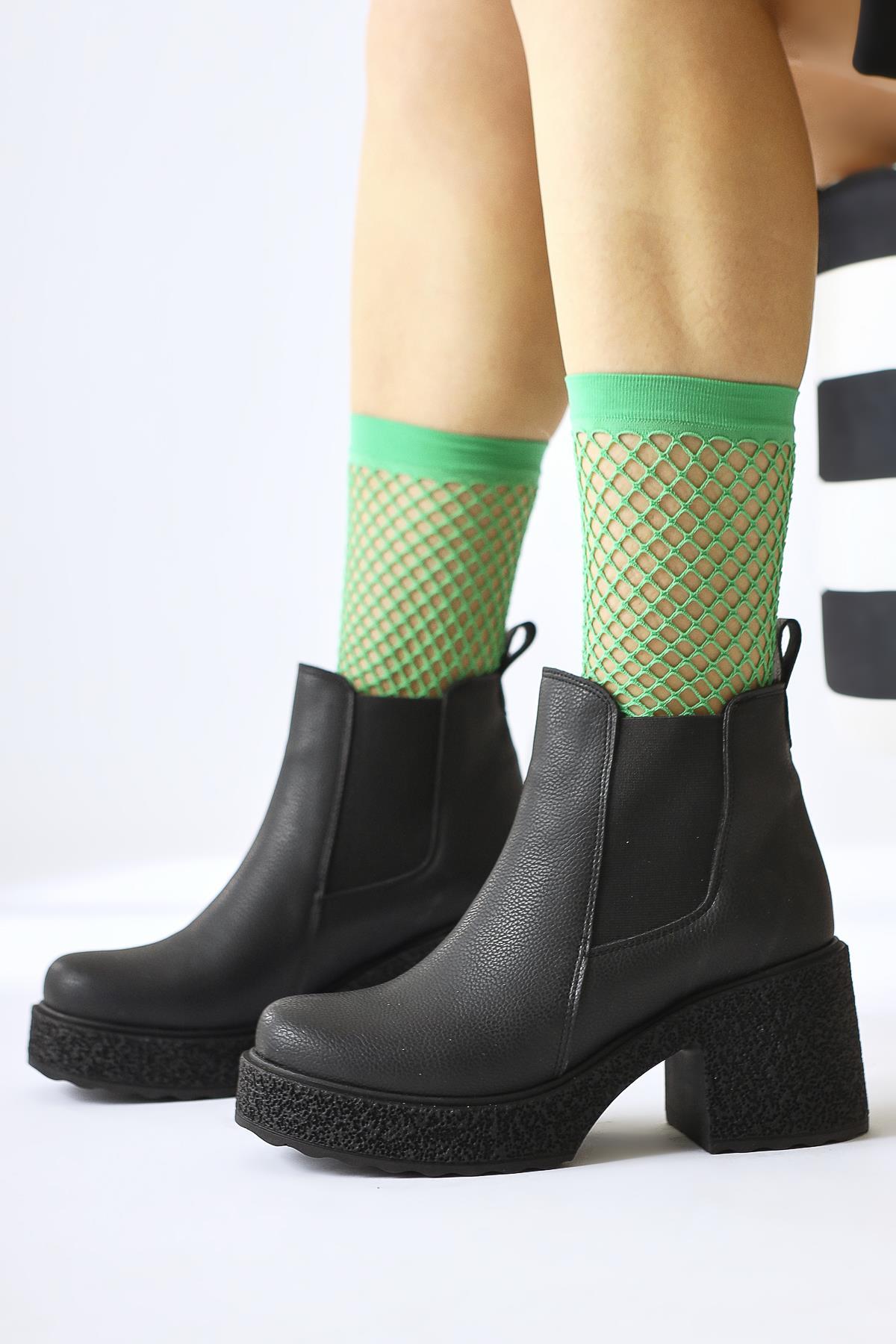 Thida – Black Elasticized Platform-Sole Pull-On Boot (Women)